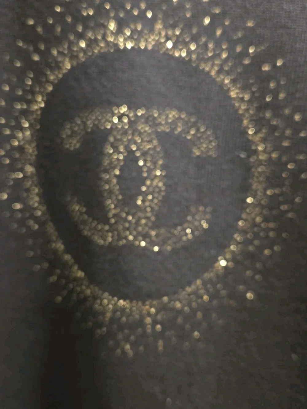CHANEL Uniform Black Crewneck Sweater with Gold CC Sunburst